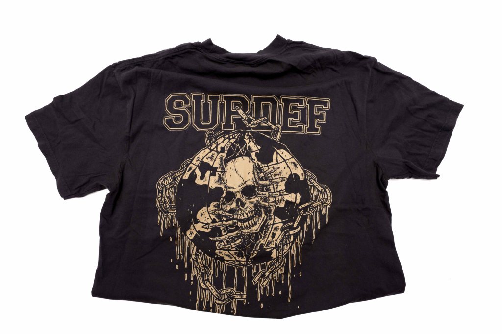 Black t-shirt featuring a skull graphic surrounded by chains and the word 'SURDEF' in bold lettering on the back.