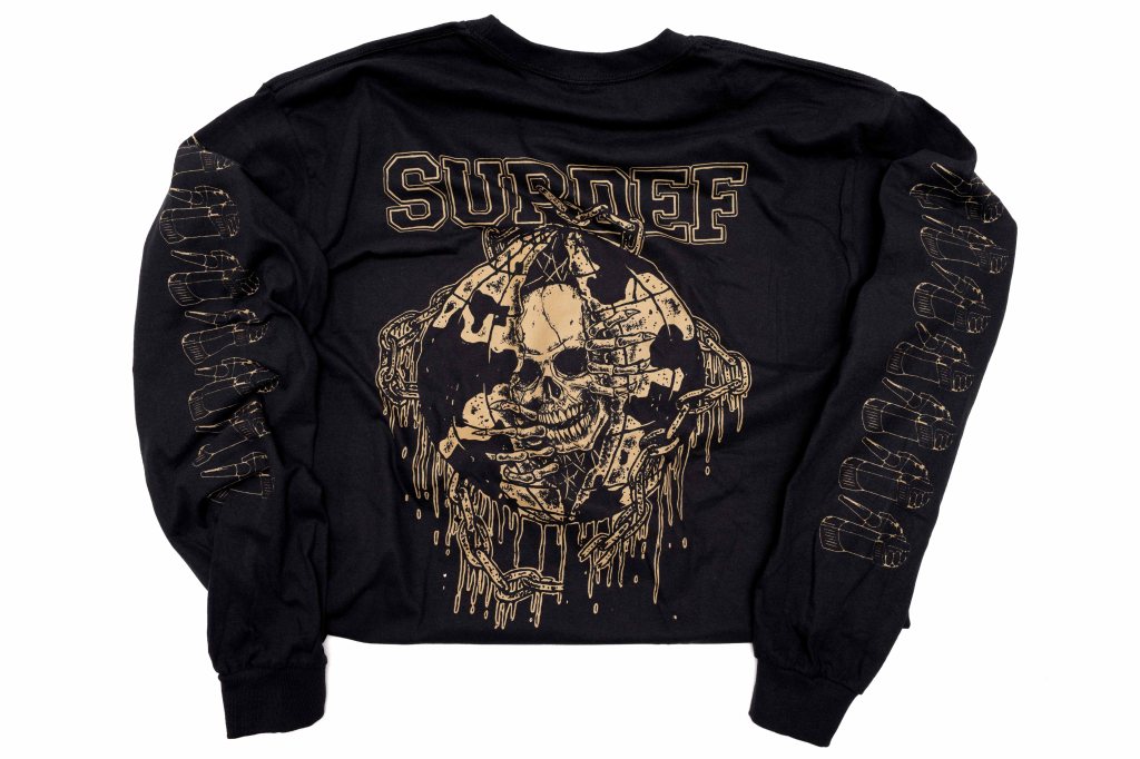 Black long-sleeve t-shirt featuring a gold graphic of a skull with dripping details and the word 'SURDEF' on the back.